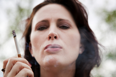 woman smoking | wirral chiropractor